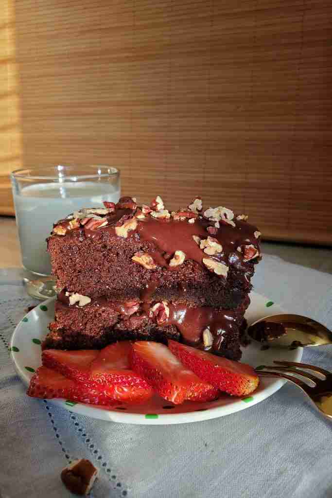 driskill-hotels-1886-chocolate-cake-round-strawberries-pecans-side-slice-milk-glass